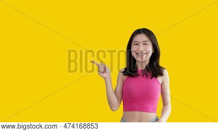 Asian Woman Pointing Finger Inviting Click Here, It Is Recommended To Follow This Direction Or Click