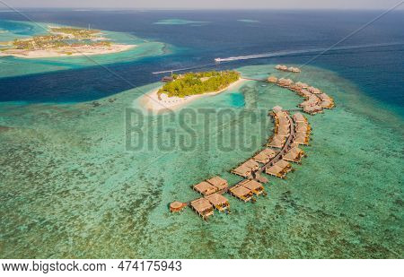 Tropical Island-resort In South Male Atoll, Maldives. Aerial Drone Shot. July 2021.