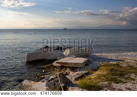 Blocks Of The Local White Marble On The Beach On The West Coast Of The Island. Calm Aegean Sea (medi
