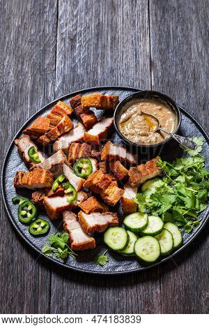 Lechon Kawali, Filipino Crispy Fried Pork Belly With Liver Sauce, Sliced Cucumber And Fresh Coriande