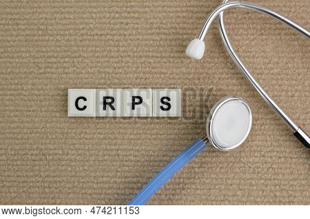 A Stethoscope With The Alphabet Letters Crps Or The Word Complex Regional Pain Syndrome