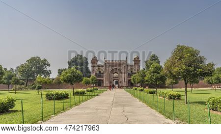 The Entrance To The Ancient Tomb Of Itmad-ud-daulah. The Red Sandstone Walls Are Decorated With Whit