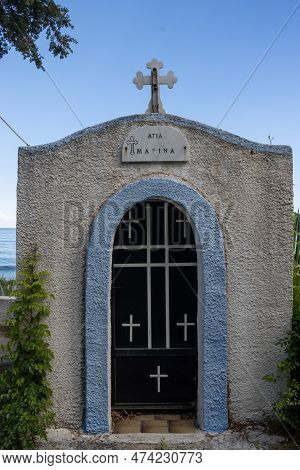 Saint Marina (agia Marina) Written Above The Door. Blue Chapel With A Cross And Angel On The Roof, B