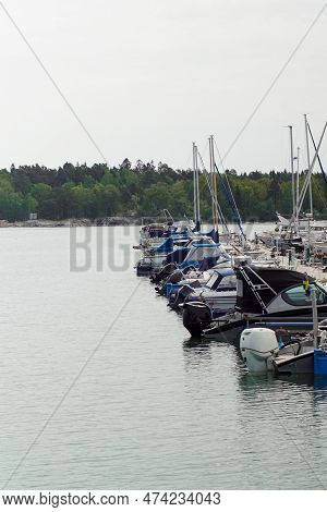 View Of Boats Moored At Harbor Against Clear Sky