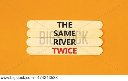 The Same River Twice Symbol. Concept Words The Same River Twice On Wooden Stick. Beautiful Orange Ta