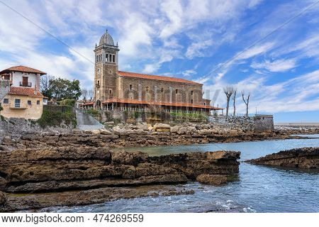 Romanesque Church Made Of Stone By The Cantabrian Sea In The Tourist Town Of Luanco, Asturias.