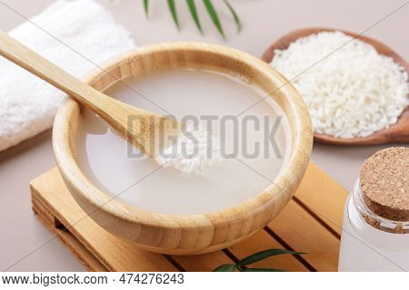 Homemade Cosmetic Rice Water With Ingredients On Beige Background, Healthy Beauty Treatment Ingredie