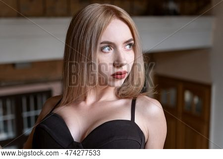 Portrait Of Young Sexy Hot Beauty Inside. Blonde Woman In The Black Bra Balconette Pushap. Sad Gaze.