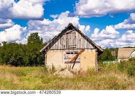 Beautiful Old Abandoned Building Farm House In Countryside On Natural Background