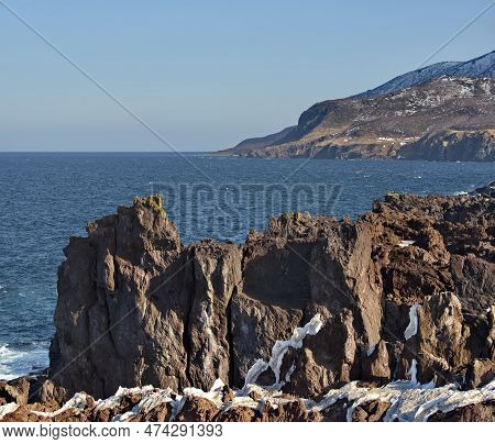 Russia. Far East, Kuril Islands. Very Hard And Sharp Basalt Rocks Along The Coast Of The Sea Of Okho