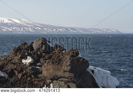 Russia. Far East, Kuril Islands. Very Hard And Sharp Basalt Rocks Along The Coast Of The Sea Of Okho