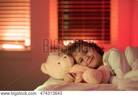 Child Go To Sleep In The Night In The Bedroom. Cute Little Boy Asleep In Bed.