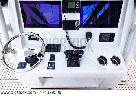Luxury Yacht Control Panel With Steering Wheel, Gear Levers, Navigation Devices, Control Buttons And