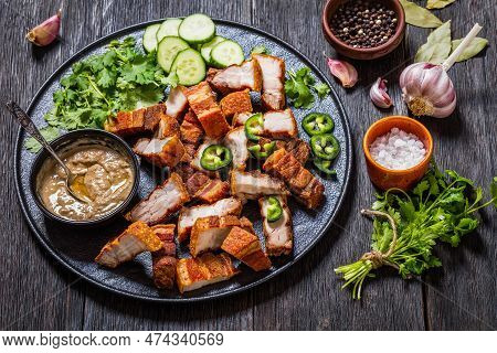 Lechon Kawali, Filipino Crispy Fried Pork Belly With Liver Sauce, Sliced Cucumber And Fresh Coriande