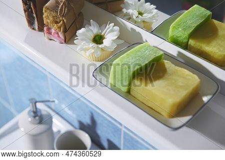 Selective Focus On White Chamomile Flower, Organic Soap Bars, Dry Solid Shampoos, Spa Scrubs In The 