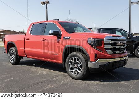 Logansport - Circa April 2023: Gmc Sierra 1500 Pickup Display At A Dealership. Gmc Offers The Sierra