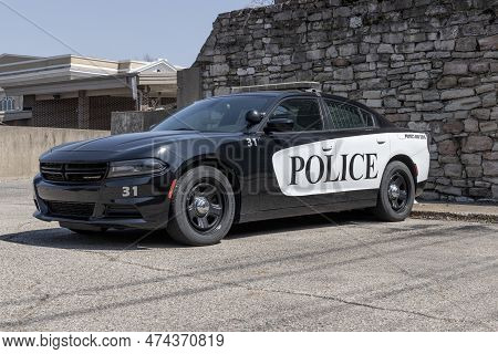 Logansport - Circa April 2023: Police Cars With The Words Protect And Serve. The Police Have A Duty 