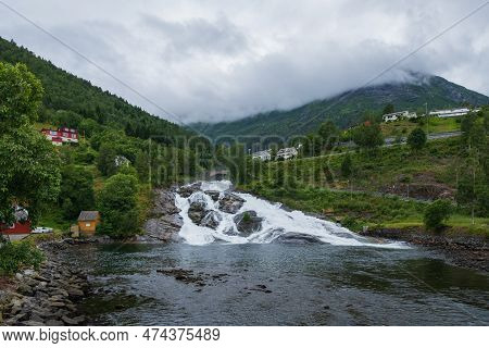 Hellesylt, Norway - July 2019: Hellesyltfossen Is One Of Many Norwegian Waterfalls In The Area Geira