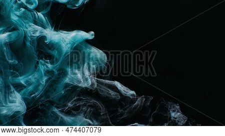 Ink Water. Mist Floating. Acrylic Paint Splash. Blue Color Glowing Glitter Fog Wave On Black Abstrac