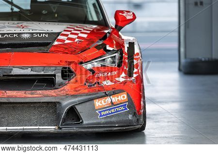 Oschersleben, Germany, April 9, 2023: Front View Of Scratched Wrecked Bumper Red Racing Cupra Cupra 