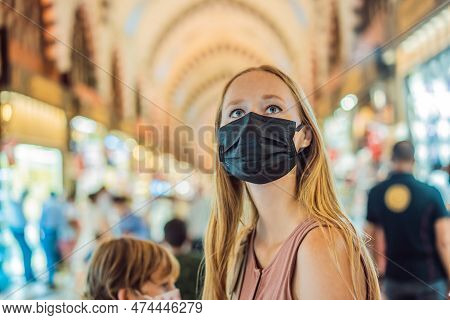 A Tourist Woman Walks Among The Countless Shops At The Grand Bazaar And Egyptian Bazaar In Istanbul.