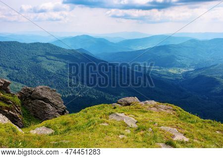 Carpathian Watershed Ridge. Stones And Boulders On The Green Grassy Hills. Hot Summer Day