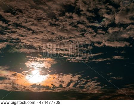 Evening Orange Sunny Sunset Behind White Clouds On Blue Sky. Morning Sunrise. White Clouds. Blue Set