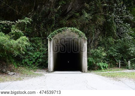 View Of An Entry Of A Long And Dark Tunnel In The Mountains At Tianxiang, Xiulin