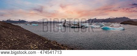 Jokulsarlon Glacial Lake, Lagoon With Ice Blocks, Iceland. Situated Near The Edge Of The Atlantic Oc