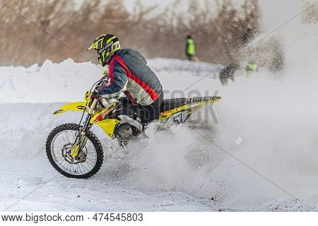 Kopeysk, Russia - January 01, 2016: Motocross Rider Riding Winter Motorcycle Racing, Ski-doo Goggle