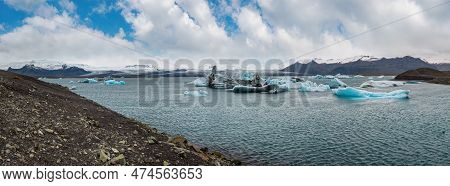 Jokulsarlon Glacial Lake, Lagoon With Ice Blocks, Iceland. Situated Near The Edge Of The Atlantic Oc