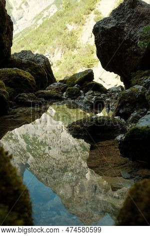 The Leogang Mountains Are Reflected In The Crystal Clear Water Of The Spring At The Birnbachloch Nea