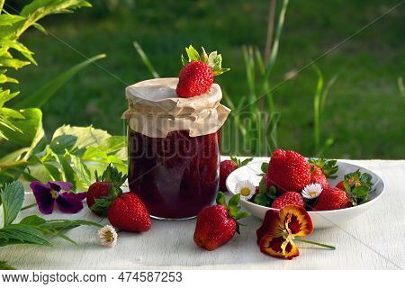 Homemade Strawberry Jam In Glass Jar And Ripe Fresh Berries Red Strawberry With Flowers Daise And Pa