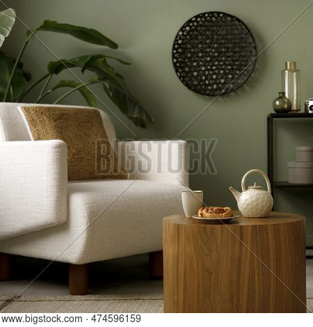 Stylish Composition Of Living Room Interior With Green Wall, Grey Sofa With Grey Pillow. White Armch