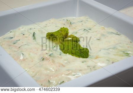 Mint Raita Yogurt Dipping Sauce Garnished And In A Bowl