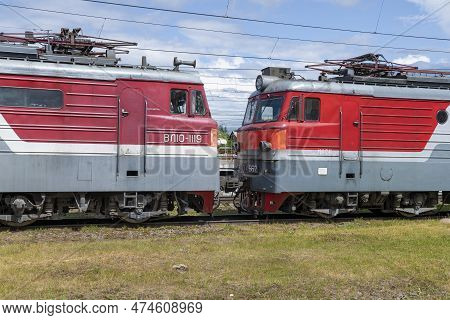 Bologoe, Russia - July 16, 2022: Cabins Of Two Soviet Electric Locomotives Vl10 Close-up On A Sunny 