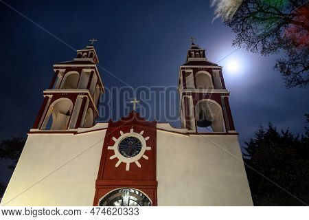 A Church At Night With A Light. San Miguel De Las Casitas Xichu Guanajuato Mexico