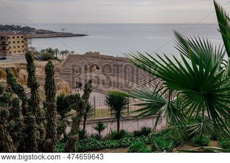 View Of The Ancient Amphitheatre In Downtown Taragona, Catalonia, Spain.