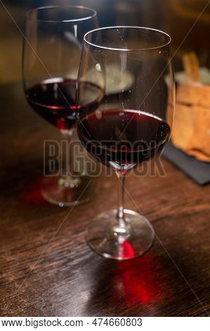 Dinner With Glass Of Dry Red Wine In Italian Osteria Restaurant
