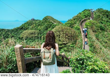 Woman Traveler Visiting In Taiwan, Tourist With Backpack Sightseeing In Bitou Cape Hiking Trail, New