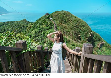 Woman Traveler Visiting In Taiwan, Tourist With Backpack Sightseeing In Bitou Cape Hiking Trail, New