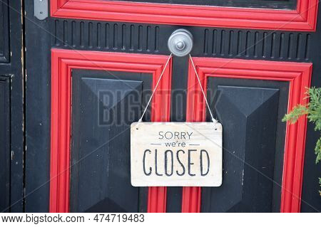 Sorry We Are Closed Sign Board Wooden Panel Hanging On Door Of Cafe