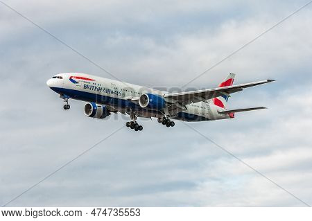 London, England - August 22, 2016: G-ymmi British Airways Boeing 777 Landing In London Heathrow Inte