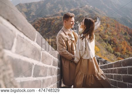 Beautiful Young Couple Showing Affection On The Great Wall Of China