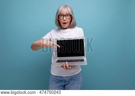Middle Age Business. Middle Aged Woman With Gray Hair Re-learn Remote Profession Using Laptop On Stu