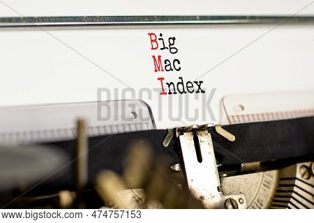 Bmi Big Mac Index Symbol. Concept Words Bmi Big Mac Index Typed On Retro Old Typewriter On A Beautif
