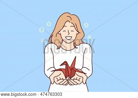 Woman With Origami Crane In Palms Wants To Draw Attention To Problem Of Wildlife And Extinction Of A