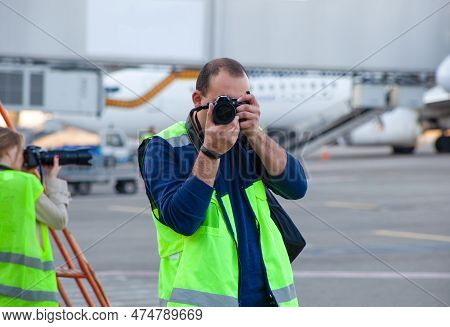 Plane Spotters At The Airport. Photographers Observe And Photograph Aircraft. Press Spotter Get Phot