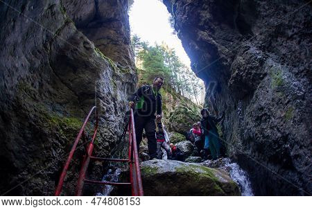 March 22 2022 - Carpathian Mountains Romania Predeal Area, Tourists Assisted By A Guide Climb The Mo