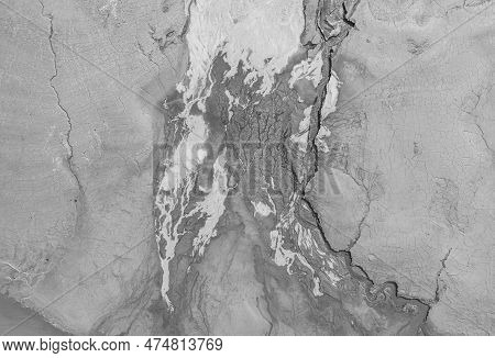 The Structure Of Cracked Wet Earth At The Bottom Of The Lake, Creating Irregular Patterns, Structure